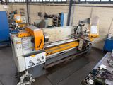 a machine that is working in a factory with a lot of tools