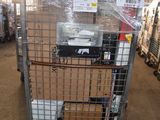 a large metal cage with a lot of items inside of it