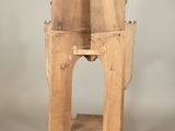 a wooden chair that is sitting on a table