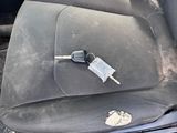 a dirty seat in the back of a car