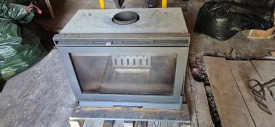 a stove that is sitting in the middle of a room