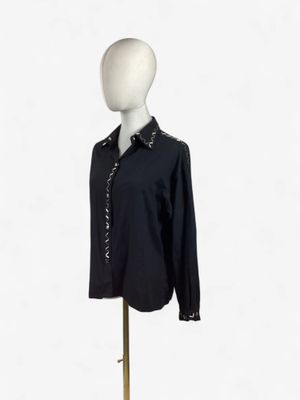 an image of a mannequin with a black shirt on it