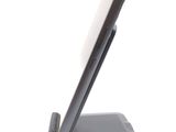 a cell phone that is sitting on top of a stand
