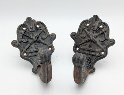 pair of antique cast iron door handles with ornate design