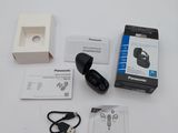 a box with a charger and other items on a table