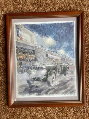 painting of a vintage car driving down a street in front of a building