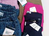 a pile of clothing that is sitting on a table