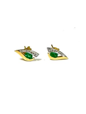 a pair of earrings with green stones on a white background