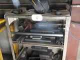 a picture of a machine that is working on a piece of metal