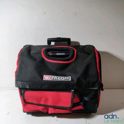 a red and black bag sitting on a white surface