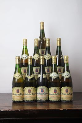 several bottles of wine sitting on top of a wooden table