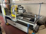 a machine that is working on a piece of paper