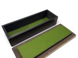 a close up of a pair of black and green trays on a white background