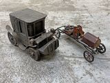 a small toy horse pulling a carriage with a cart attached to it