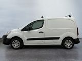 the white van is parked on the concrete floor in the room