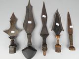 several different types of weapons are displayed on a white surface