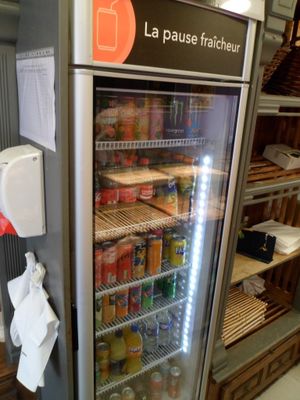 a refrigerated refrigerator in a store filled with food