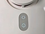 a close up of a button on the side of a blender