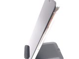 a cell phone that is sitting on top of a stand
