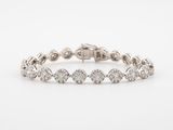 a white gold bracelet with diamonds on a white background