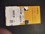 the back of a yellow box with a barcode on it