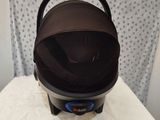 a baby stroller sitting on top of a white table