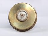 a close up of a metal object on a white surface
