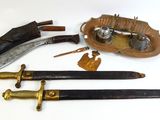 three different types of knives on a white surface