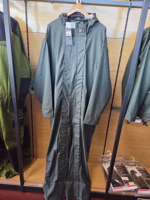 a green rain suit hanging on a rack in a store