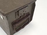 a small metal box with a key in it