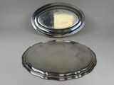 an antique silver plate with a mirror in the middle of it