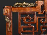 an image of a wooden chair with a dragon on the back of it