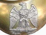 a gold collar with a silver eagle on it