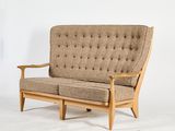 a couch that is sitting on a white surface