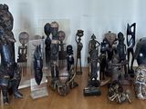 a lot of wooden statues on a table