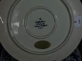 a white plate with a blue and white design on it