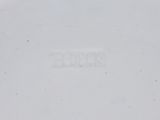 a close up of a white plate with the word rock written on it