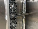 a large metal door with fans inside of it