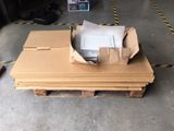 a pile of cardboard sitting on top of a pallet