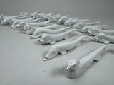 a lot of white figurines of animals on a table