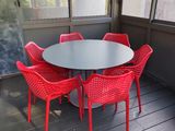 an image of a table and chairs on a porch