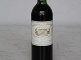 a bottle of wine that is sitting on a table