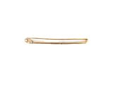 a gold bar with a single diamond on top of it