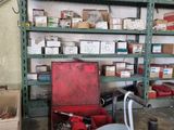 many boxes and boxes on a shelf in a room