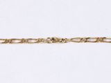 a close up of a gold chain on a white background