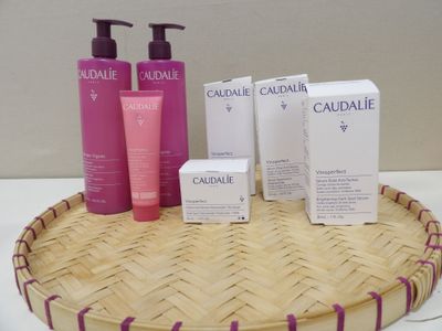 a basket that has a lot of bottles and soaps on it