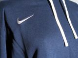 the back of a blue hoodie with a white nike logo on it