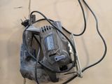 a picture of a corded sander sitting on a table
