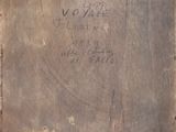 an old wooden box with writing on it sitting on top of a table