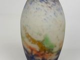 a vase that is sitting on a white surface
